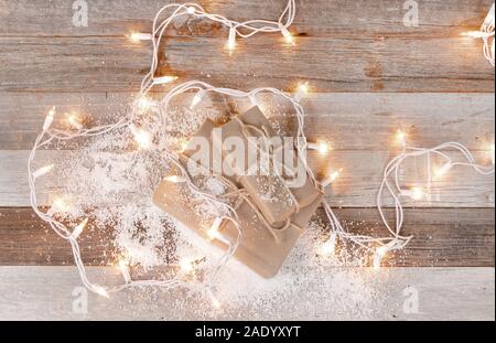 Christmas background with gift boxes and christmas ornaments on wooden board Stock Photo