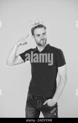 Narcissistic prince. Prince golden crown. Funky prince. Glory seeking man. Man representing power and triumph. Business king. Cheerful guy wear crown. King of style. Achieving victory and success. Stock Photo
