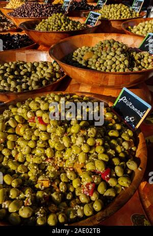 Big bowls of different kind of olives on display Stock Photo