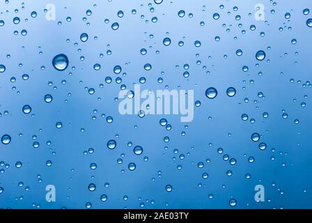 Water droplets forming on glass. Stock Photo