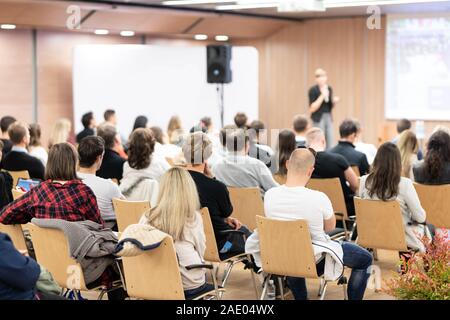 Female speaker giving presentation on business conference. Stock Photo