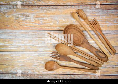 Natural kitchen tools wood products / Kitchen utensils background with spoon fork chopsticks ladle and dessert spoon various sizes on plate object ute Stock Photo