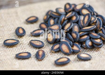 watermelon seeds on sack / close up dried watermelon seed with salt for food or snack Stock Photo