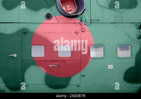 Bangladesh flag depicted on side part of military armored helicopter close up. Army forces aircraft conceptual background Stock Photo