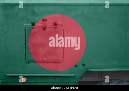 Bangladesh flag depicted on side part of military armored truck close up. Army forces vehicle conceptual background Stock Photo