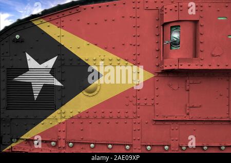 Timor Leste flag depicted on side part of military armored tank close up. Army forces conceptual background Stock Photo