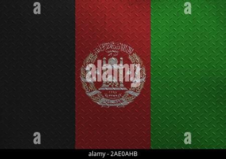 Afghanistan flag depicted in paint colors on old brushed metal plate or wall close up. Textured banner on rough background Stock Photo