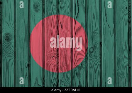 Bangladesh flag depicted in bright paint colors on old wooden wall close up. Textured banner on rough background Stock Photo