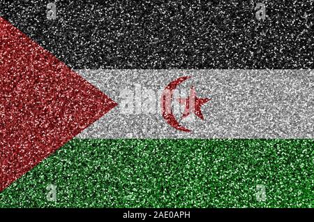 Western Sahara flag depicted on many small shiny sequins. Colorful festival background for disco party Stock Photo