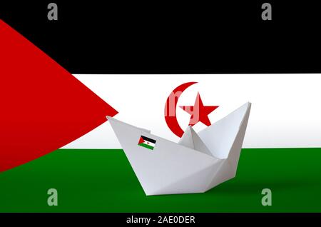 Western Sahara flag depicted on paper origami ship closeup. Oriental handmade arts concept Stock Photo