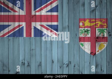 Fiji flag depicted in bright paint colors on old wooden wall close up. Textured banner on rough background Stock Photo
