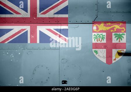 Fiji flag depicted on side part of military armored helicopter close up. Army forces aircraft conceptual background Stock Photo