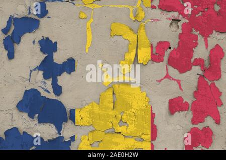 Chad flag depicted in paint colors on old obsolete messy concrete wall close up. Textured banner on rough background Stock Photo