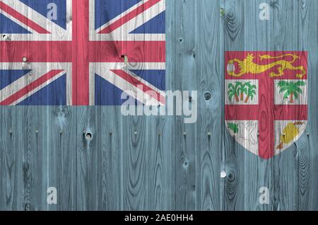 Fiji flag depicted in bright paint colors on old wooden wall close up. Textured banner on rough background Stock Photo