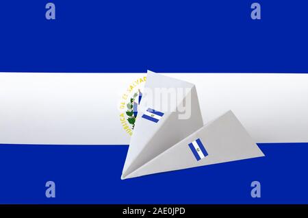 El Salvador flag depicted on paper origami airplane. Oriental handmade arts concept Stock Photo