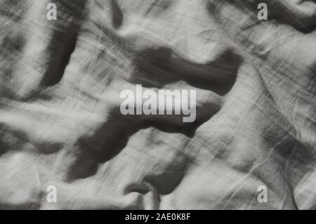 Abstract background of a crumpled bed cloth Stock Photo