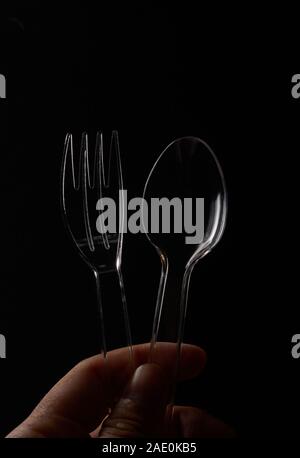 The plastic spoons and forks with black background Stock Photo