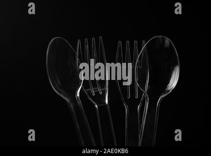 The plastic spoons and forks with black background Stock Photo
