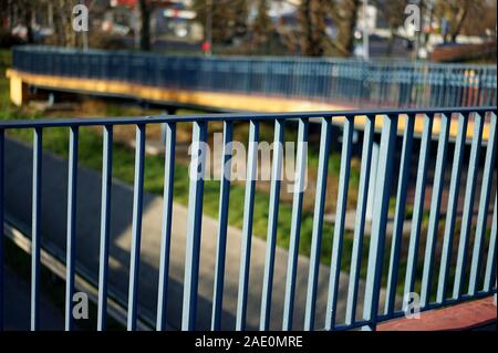 railings - a handrail of metal bars on the viaduct above the road Stock Photo