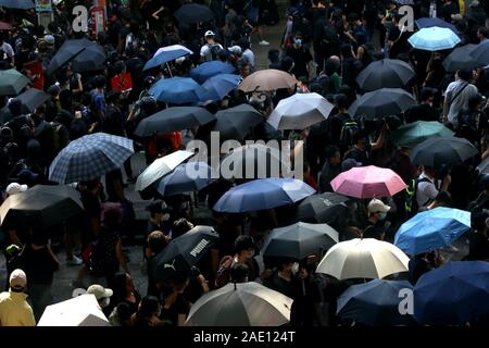 Undeterred by a police opposition, hundreds of thousands marched in Tsim Sha Tsui on October 20th in opposition to an anti-mask law. Stock Photo