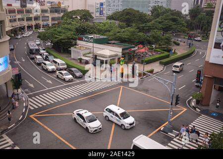 Manila, Philippines - August 22, 2017: Traffic and cars at intersection in Makati in rush hour Stock Photo