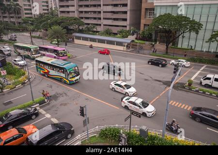 Manila, Philippines - August 22, 2017: Traffic and cars at intersection in Makati in rush hour Stock Photo