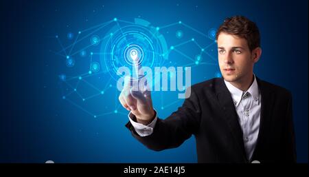 Man touching hologram screen displaying keys and locks Stock Photo