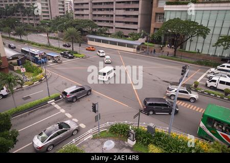 Manila, Philippines - August 22, 2017: Traffic and cars at intersection in Makati in rush hour Stock Photo