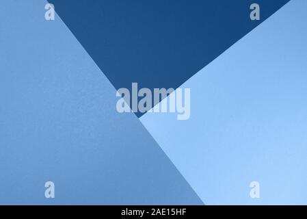 Background in trendy blue colors. Fashionable paper. Top view. Minimal concept. Trendy monochrome color. Stock Photo