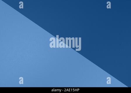 Background in trendy blue colors. Fashionable paper. Top view. Minimal concept. Trendy monochrome color. Stock Photo