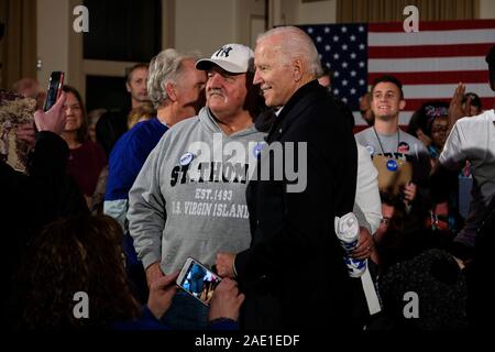 Presidential candidate former Vice President Joe Biden poses for a selfie with his supporters during his “No Malarkey” bus tour  in Waterloo. Stock Photo