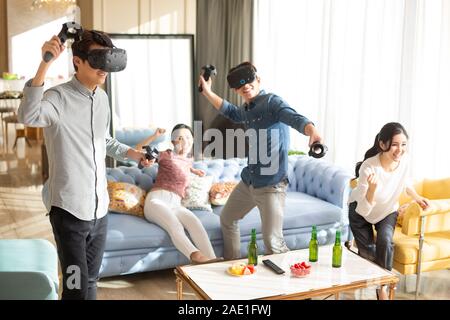 Young friends playing VR game Stock Photo