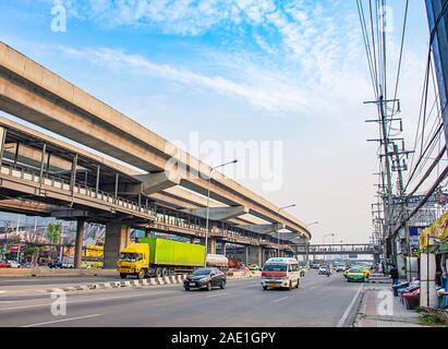 Many cars on the road and sky rails  at Kanchanaphisek Road, central west gate , Nonthaburi  in Thailand.  January 7, 2019 Stock Photo