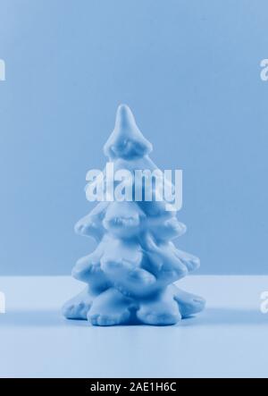 Amazing Monochrome blue christmas tree in trendy colors palette. New year card. Minimalism concept. Stock Photo