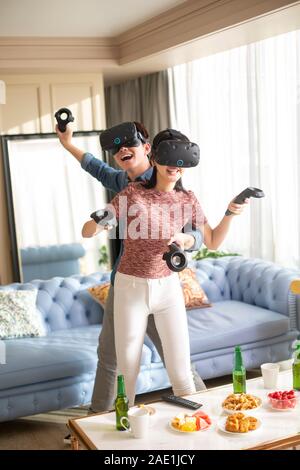 Young couple playing VR game Stock Photo