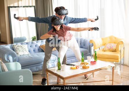 Young couple playing VR game Stock Photo