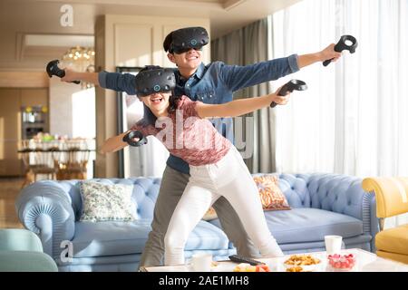 Young couple playing VR game Stock Photo