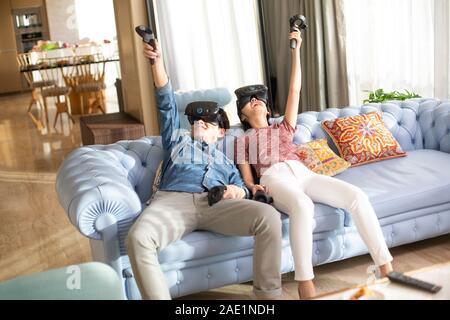 Young couple playing VR game Stock Photo
