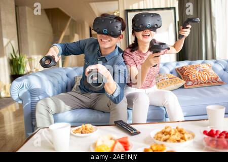 Young couple playing VR game Stock Photo