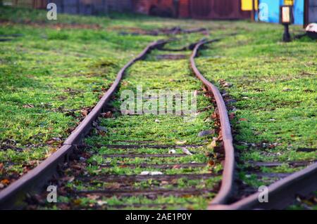 Old rusty and folded railway. Damaged train road in macro view. Stock Photo