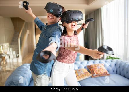 Young couple playing VR game Stock Photo