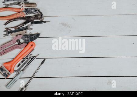 tools for repairs lies on the white boards Stock Photo