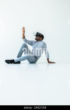 Smiling adult afro american man using vr device Stock Photo