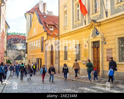 People walking past the Liaison Office of the Free State of Saxony in Lesser Town Prague Czech Republic. Stock Photo