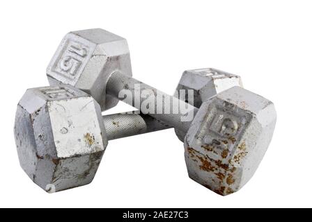 Pair of vintage free hand weights that are 15 fifteen pounds each on an isolated white background. Stock Photo