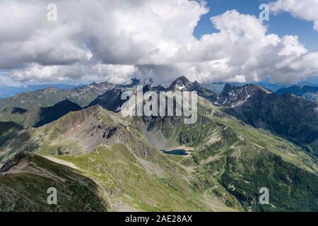 aerial, from a small plane, of Devil lake and range nearby in Orobie mountains, shot in bright summer light, near Carona, Lombardy , Italy Stock Photo