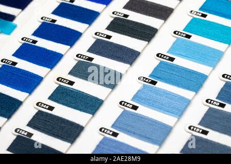 Various blue color hue yarn thread sample swatches close-up Stock Photo