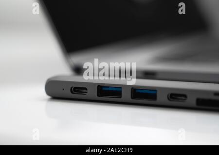 The USB adapter under the Type-C connector for laptop. Multiport station for laptop with multiple different ports. USB to USB Type-C Hub Converter Stock Photo