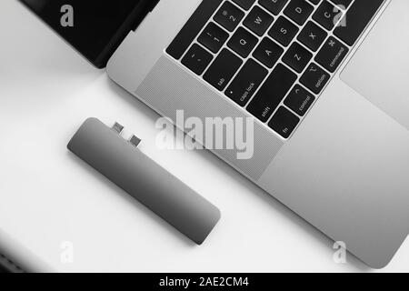 The USB adapter under the Type-C connector for laptop. Multiport station for laptop with multiple different ports. USB to USB Type-C Hub Converter Stock Photo