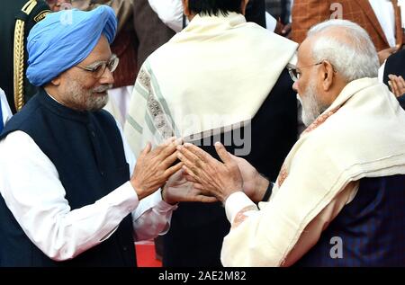 New Delhi, India. 6th Dec, 2019. Indian Prime Minister Narendra Modi (R) greets former Prime Minister Manmohan Singh on the death anniversary of Dr. B.R. Ambedkar, who was one of the architects of the Indian constitution in New Delhi, India, Dec. 6, 2019. Credit: Partha Sarkar/Xinhua/Alamy Live News Stock Photo